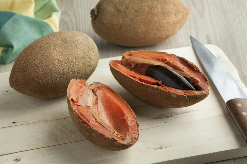 Fresh mamey fruit cut in two parts