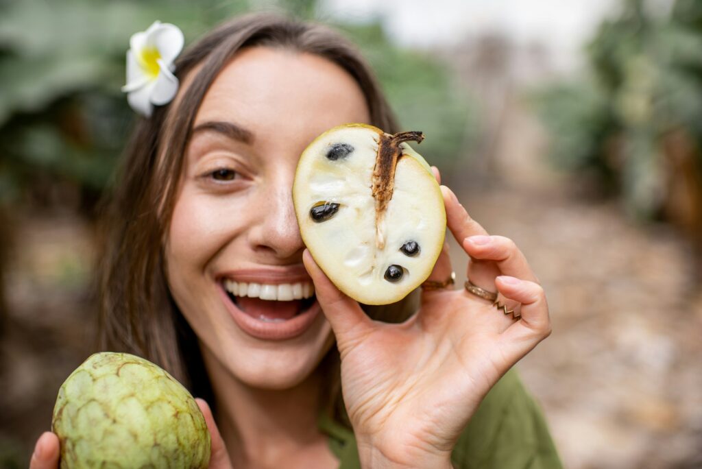 Portrait of a woman enjoy the guanabana fruit benefits